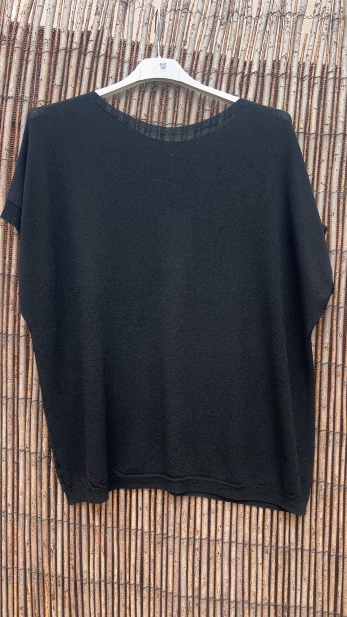 Jersey punto negro cuello redondo