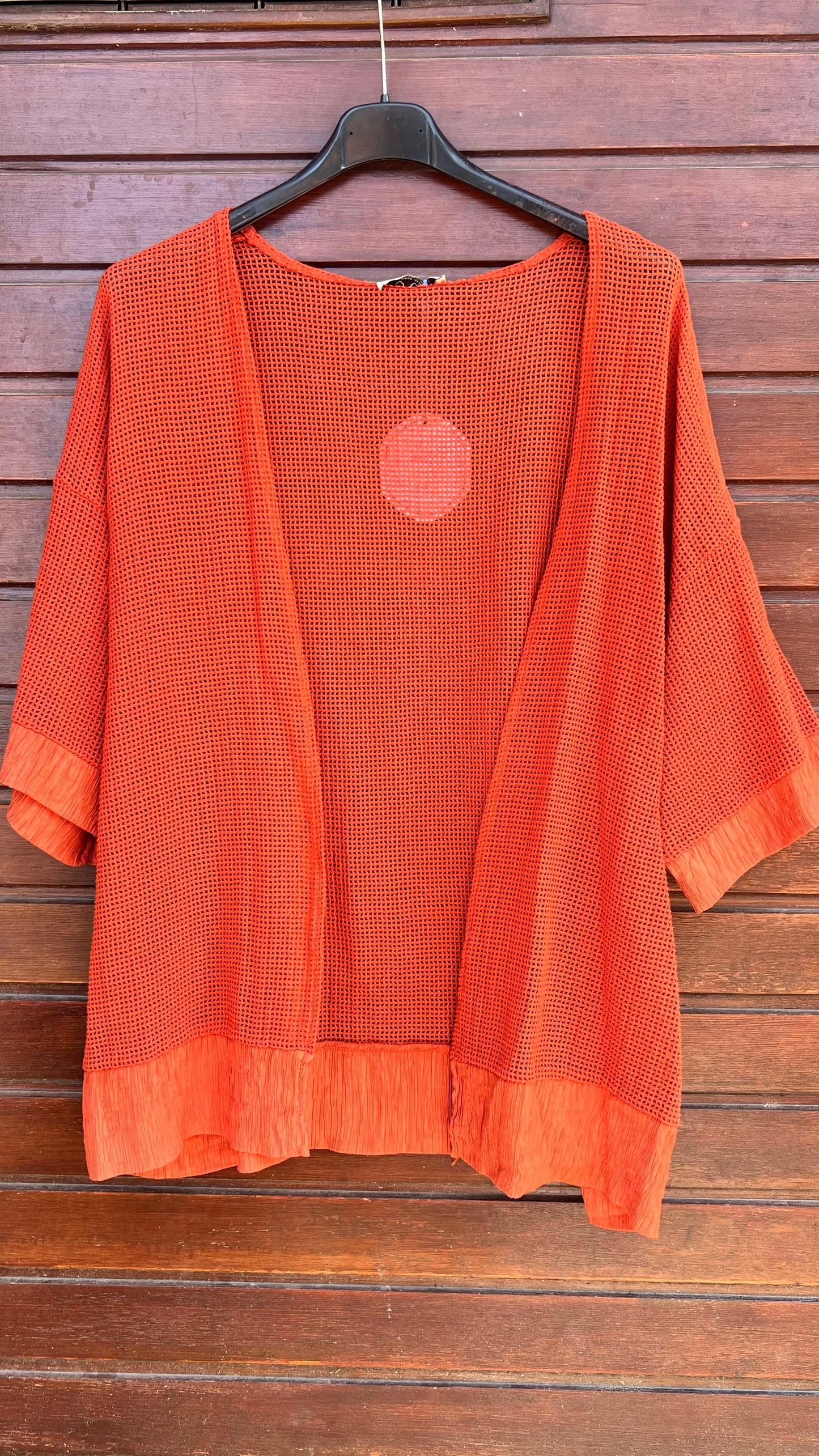 Chaqueta calada teja