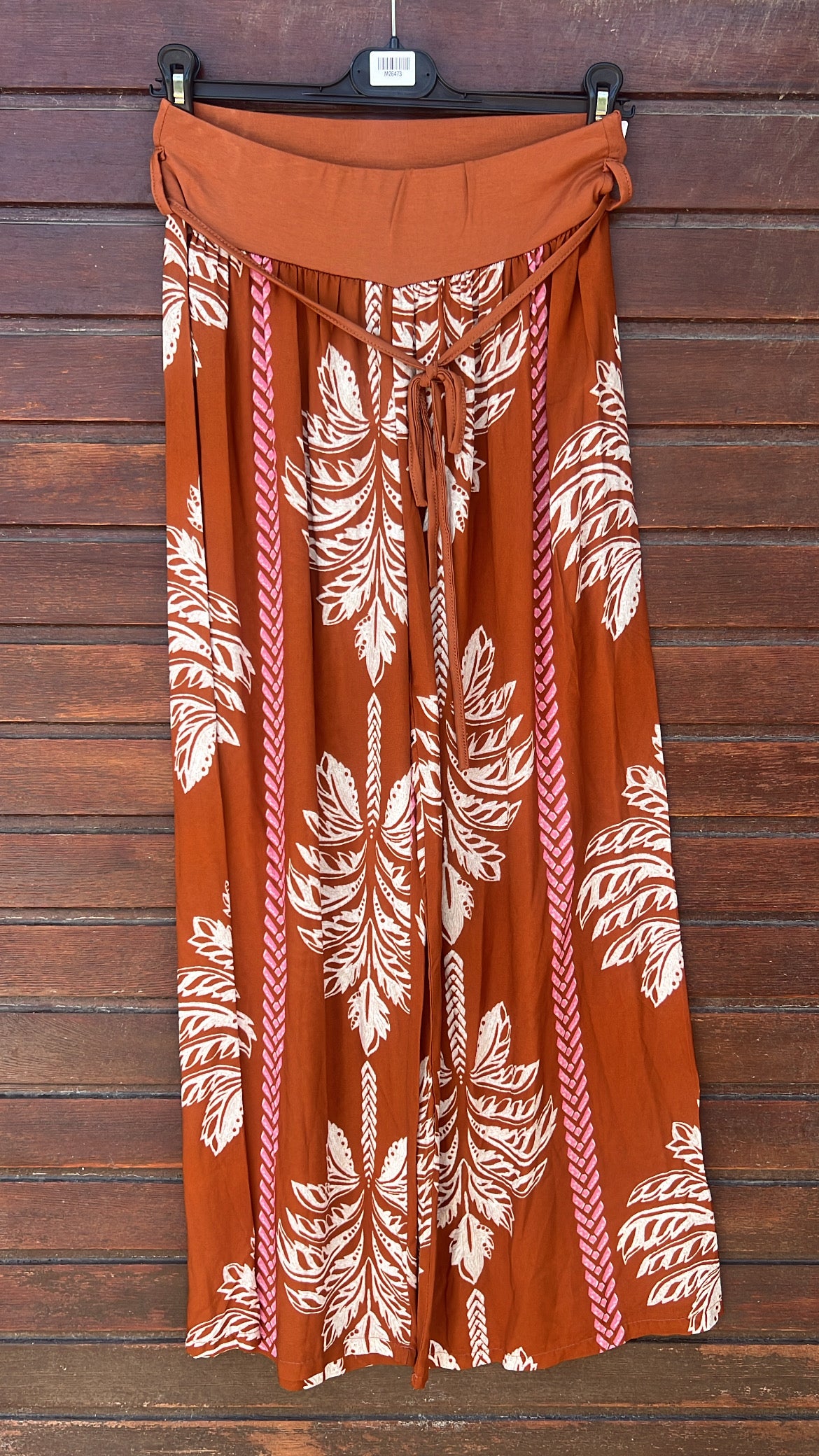 Pantalón estampado palmeras teja